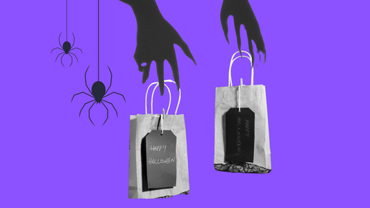 Purple background with spooky spider graphics and two gift bags labeled 'Happy Halloween,' showcasing Halloween-themed designs that pair well with the best horror t shirts for the season.