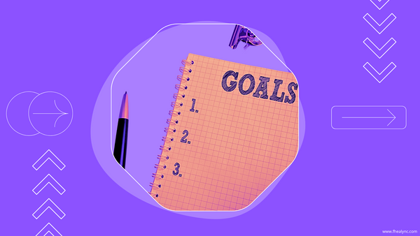 Notebook labeled 'GOALS' with a pen, symbolizing self-love and personal goals.
