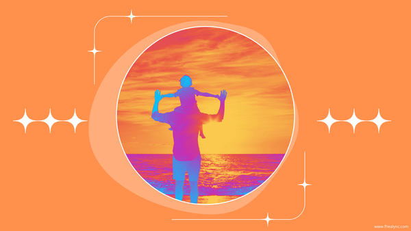 Father with child on shoulders at sunset, symbolizing self-love for fathers through connection and joy.