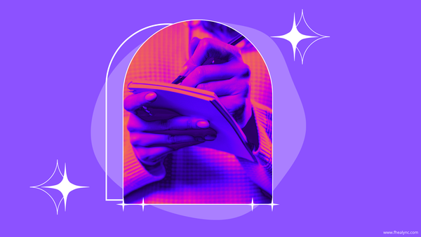 Close-up of a person writing in a notebook, creating a self-love to-do list as part of their daily self-care routine.